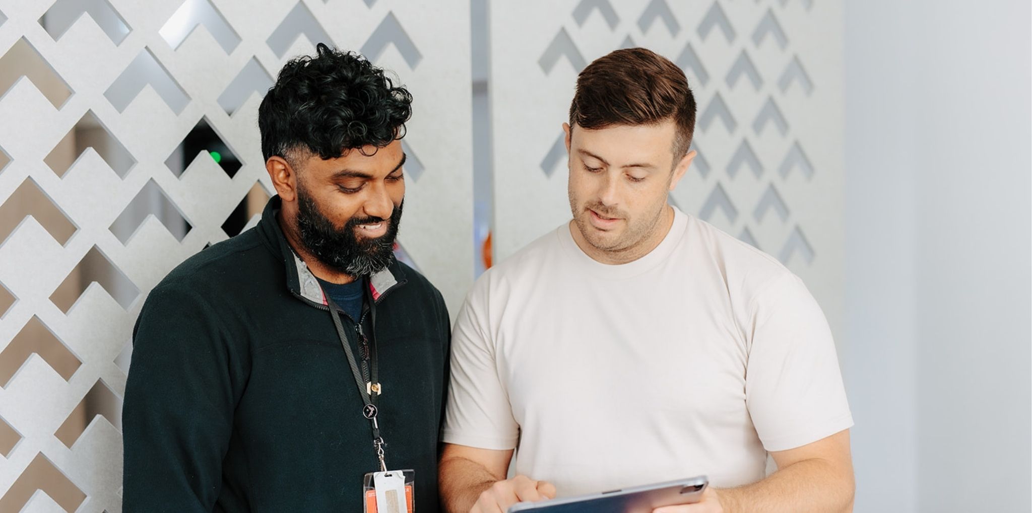 Two people looking at ipad